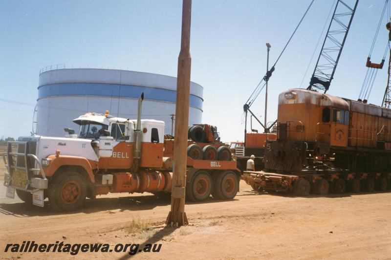 P12528
Port Hedland, Nelson Point, hard stand area, former Goldsworthy A class No.5 English Electric loco on a Bell road float for transporting south

