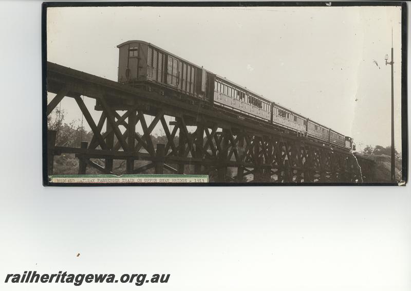 P12553
MRWA FA class 306 brakevan on passenger train hauled by a C class loco on the trestle bridge at Middle Swan, MR line . (scanned print located in MC1B2G)
