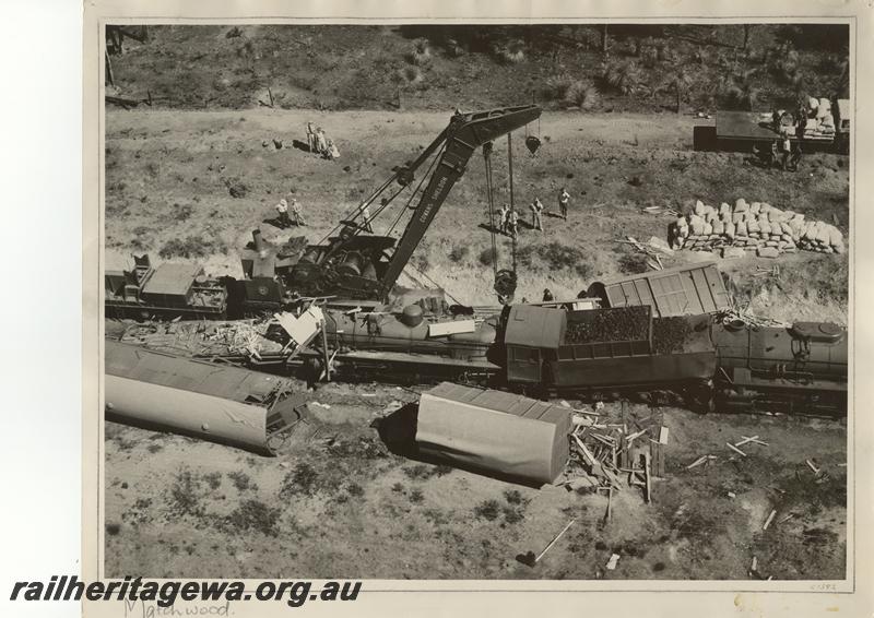 P12556
PM class 717, V class 1208, Cowans Sheldon 60 ton steam breakdown crane N0.31, aerial view of collision at Werribee, ER line. (scanned print located in MC1B2G)

