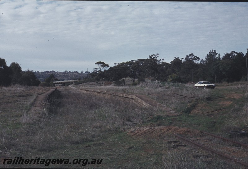P12978
Station platforms, abandoned, Clackline, ER line, view along the right of way, road bridge in the background.
