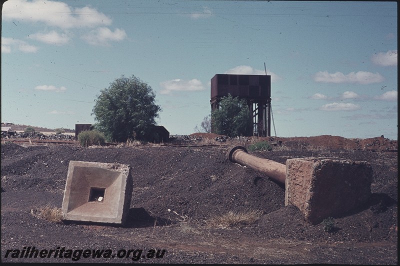 P13179
Water tower with a 25,000 gallon cast iron tank, water column and drain sump uprooted and lying on the ground, Menzies, KL line..
