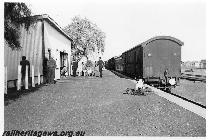 P14245
Station building, with staff and passengers on the platform, Kookynie, KL line, mixed train at the platform, view along the platform. Looking south.
