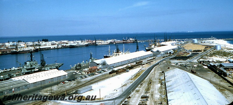 P14466
Harbour, Fremantle, elevated view across the harbour taken from the silos on the North Wharf, shows steam locos shunting on the tracks servicing the wharf
