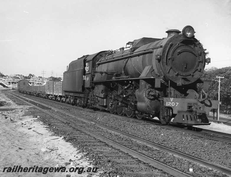 P14589
V class 1207, footbridge in background, location Unknown, goods train.
