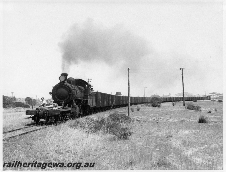 P14663
F Class propelling a NS Class shunters float hauling a long train of GH Class high sided wagons, between Bunbury and Bunbury Powerhouse
