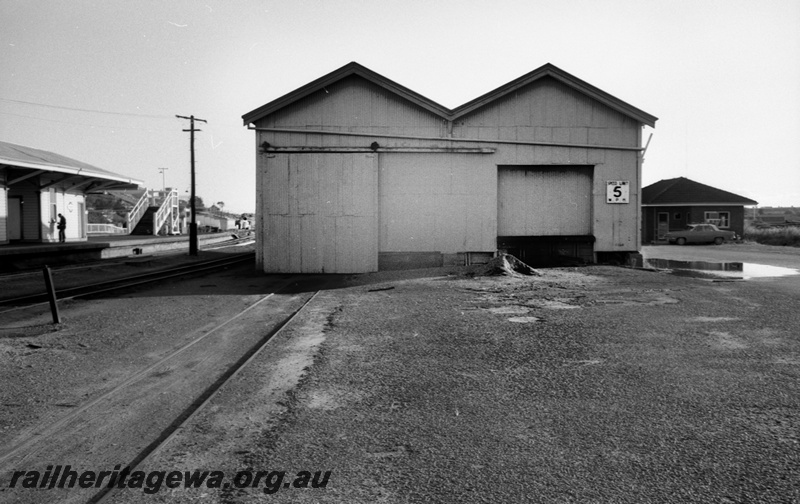 P14805
2 of 21 images of the railway precinct and station buildings at Subiaco, c1969, goods shed, end view, shows the track entering the shed
