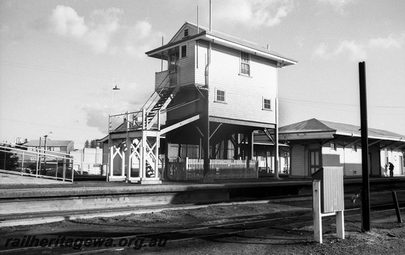 P14806
3 of 21 images of the railway precinct and station buildings at Subiaco, c1969, signal box, island platfrom building, fire hose box, view from the yard looking towards the main platform.
