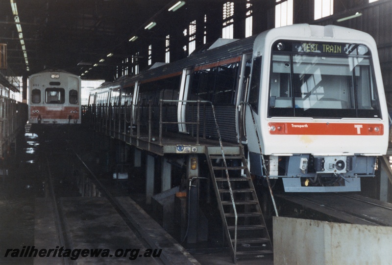 P14842
Inside the Claisebrook diesel railcar depot shed, front view of AEB class 320 EMU trailer on a Test Train, side and end view and ADC class 852 diesel railcar trailer car, end view, Claisebrook.
