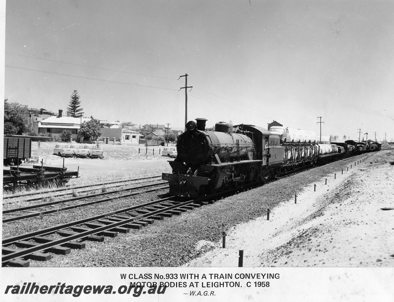 P14874
W Class 933 steam locomotive on goods train loaded with car bodies and other goods, semaphore signal, Cottesloe, ER line
