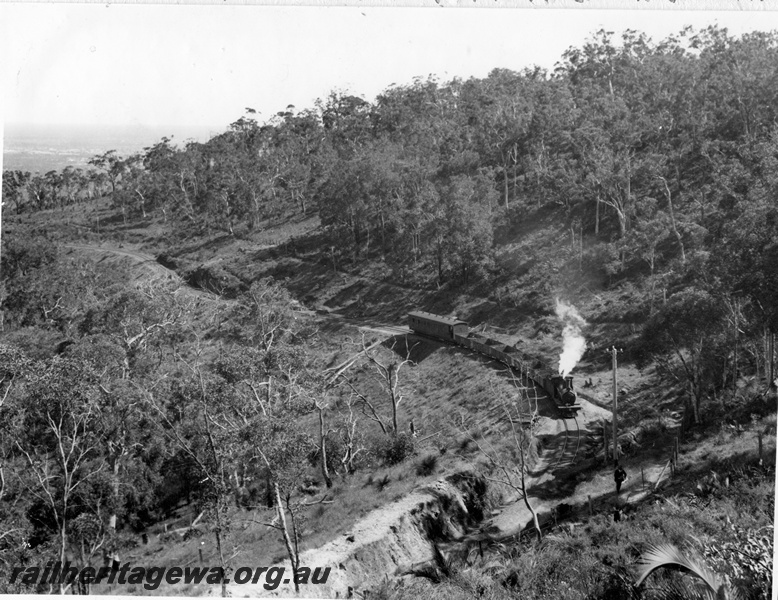 P14877
G class steam locomotive on a mixed train heading to Kalamunda, above the zig zag, UDRR line, elevated view, same as P7682
