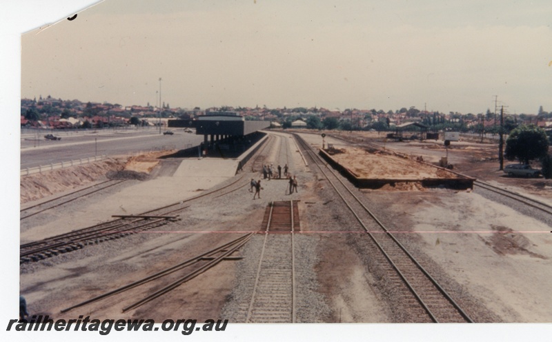 P16311
East Perth terminal construction, platforms, canopy, standard and narrow gauge tracks, sleepers, workers, East Perth, ER line
