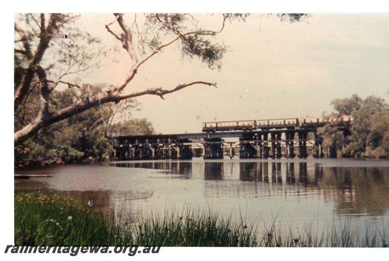 P16349
ADG Class railcar set with AYE Class carriage, crossing wooden bridge over Swan River, Guildford, ER line, side on view 
