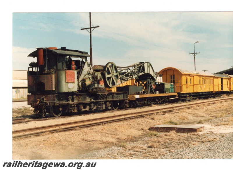 P16368
Breakdown train, Cravens 25 ton steam crane No. 23, yellow vans, East Perth, end and side view
