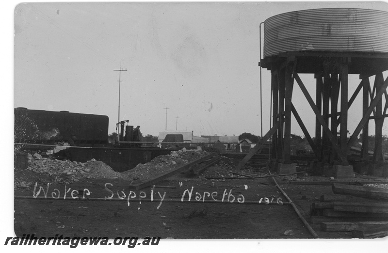 P16795
Water tower with a cylindrical corrugated iron tank, Naretha. Commonwealth Railways (CR) - TAR line,
