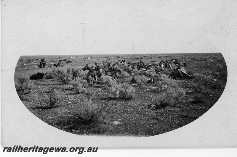 P16815
Commonwealth Railways (CR) - TAR line track workers having a crib break. c1916
