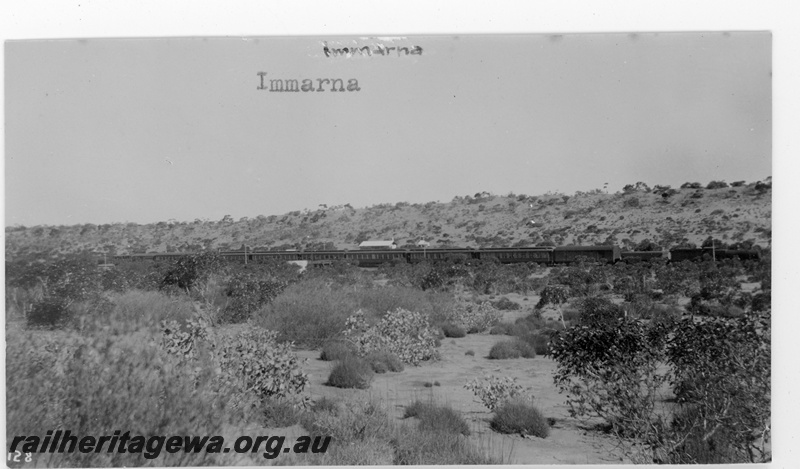 P16882
Commonwealth Railways (CR) - TAR line distant view - side on of Transcontinental express (train # 1) hauled by G class 3 at Immarna.
