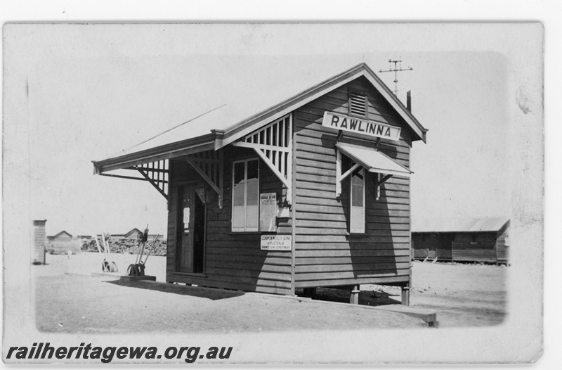 P16886
Commonwealth Railways (CR) - TAR line Rawlinna Station building. Sign on station building 