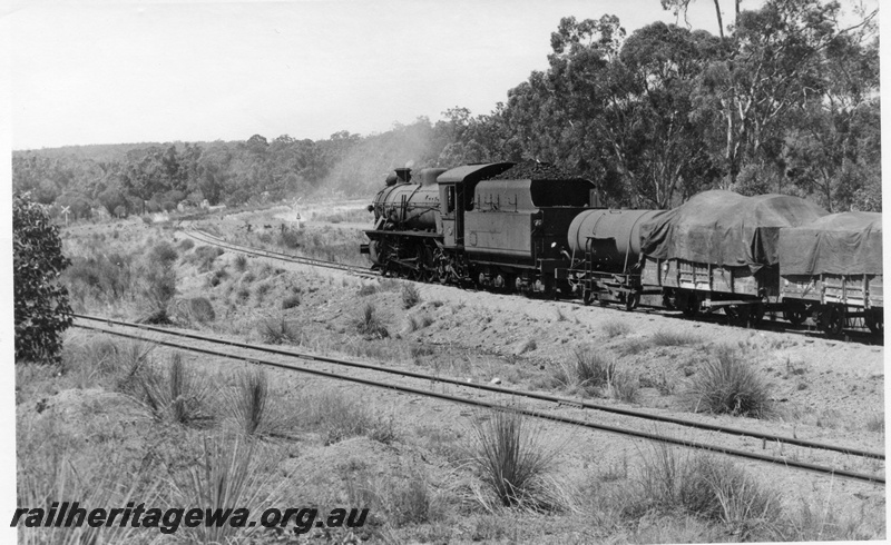 P17360
W class 911 steam locomotive, side and end view, on goods train to Wagin, leaving Bowelling, line on the left is the Narrogin line, WB line.
