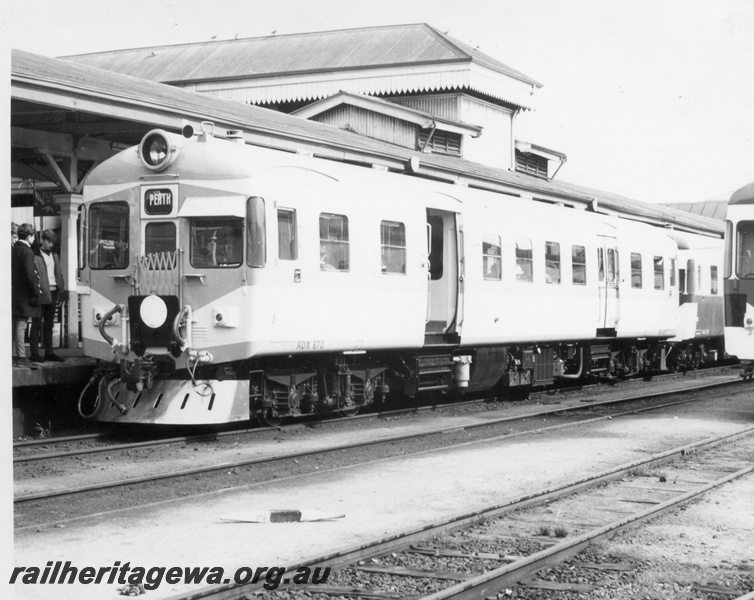 P17797
ADX class 670, Nanking blue and light grey livery, stainless steel cowcatcher, white tail disc, on a three car suburban service, end and side view,  Perth Station, ADX 670 ran in this livery from 7.7.1966 to 22.10.1968.
