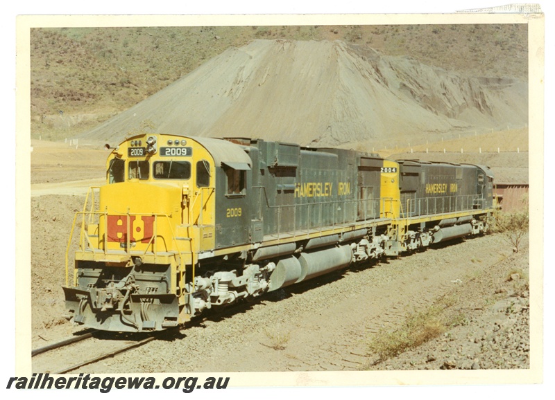 P18830
Hamersley Iron (HI) M636 class 2009, C628 class 2004 at load out tunnel Mount Tom Price. 
