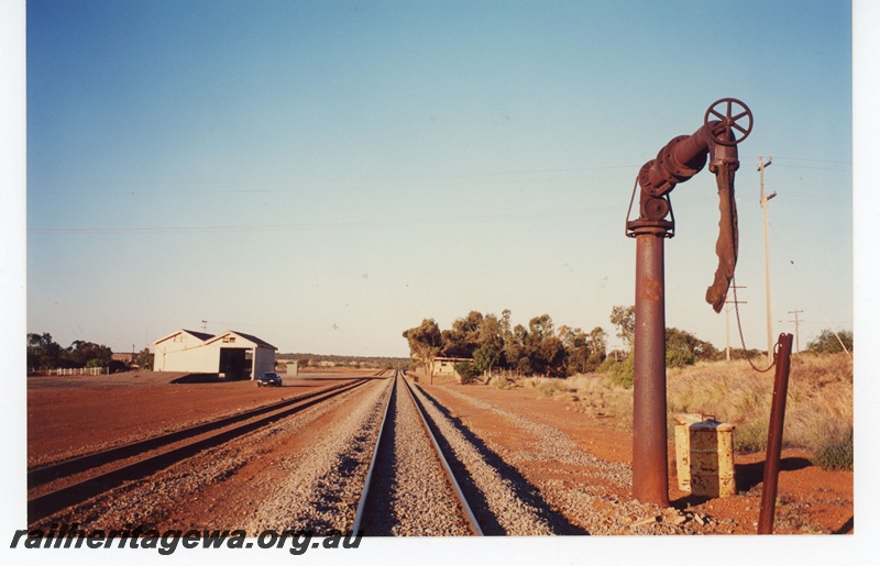 P19075
Mullewa - goods shed, water column and station in background. View looking east. NR line
