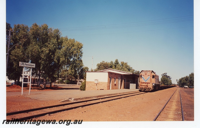 P19077
Westrail AB class 1534 hauling a rails train through Perenjori. Station nameboard and building in photo. EM line.
