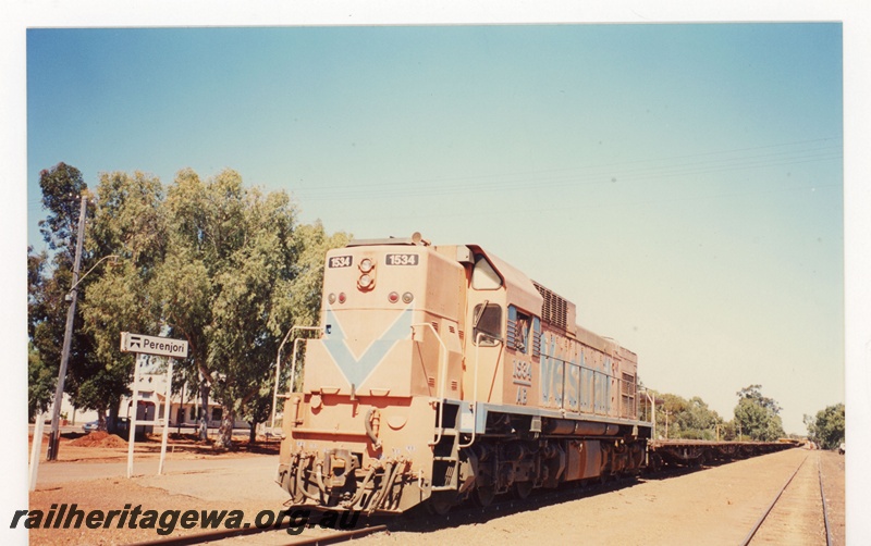 P19078
Westrail AB class 1534 hauling a rails train through Perenjori. Station nameboard in photo. EM line.
