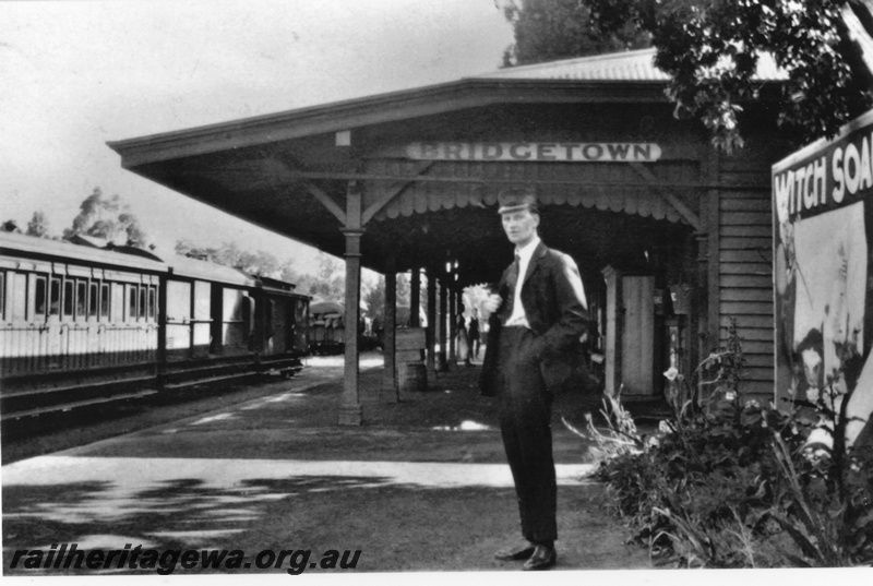 P19612
Bridgetown platform - guard on platform station nameboard in background. PP line
