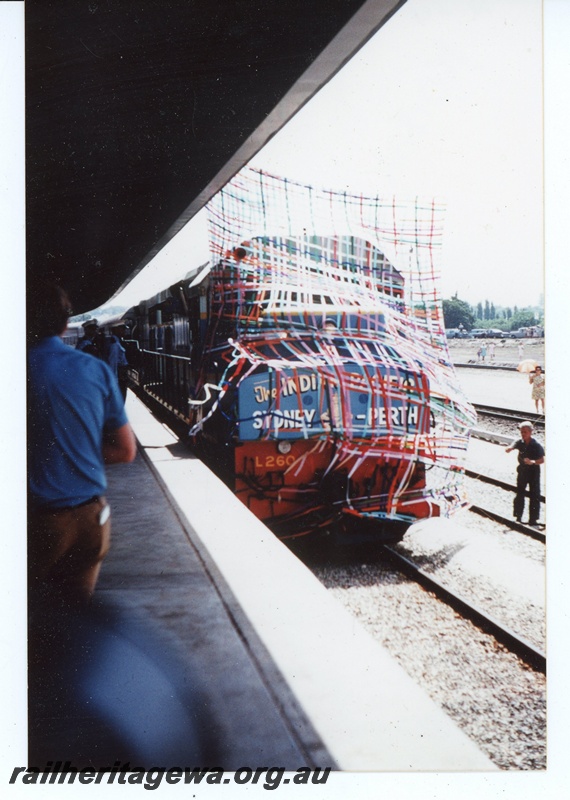 P19650
L Class 260 and L Class 261 breaking through a banner of streamers arriving at Perth Terminal on the inaugural 'Indian Pacific' passenger train from Sydney
