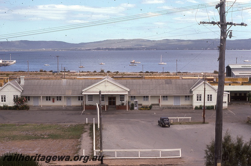 P19830
Station building, carpark, harbour in background, Albany, GSR line, view of faade from road side
