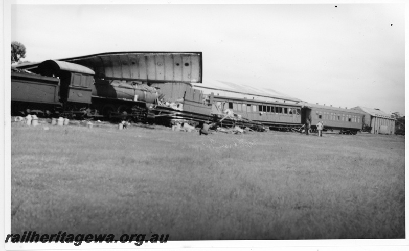 P20074
Scene of collision when ES class 336 on No 6 Passenger train from Narrogin ran into the rear of  No 8 Passenger  from Albany to Perth, ACL class and AQ class 339 ,  ES class 336, under remains of ZJ class 360, , wheat bin, onlookers, Mount Kokeby, GSR line 
