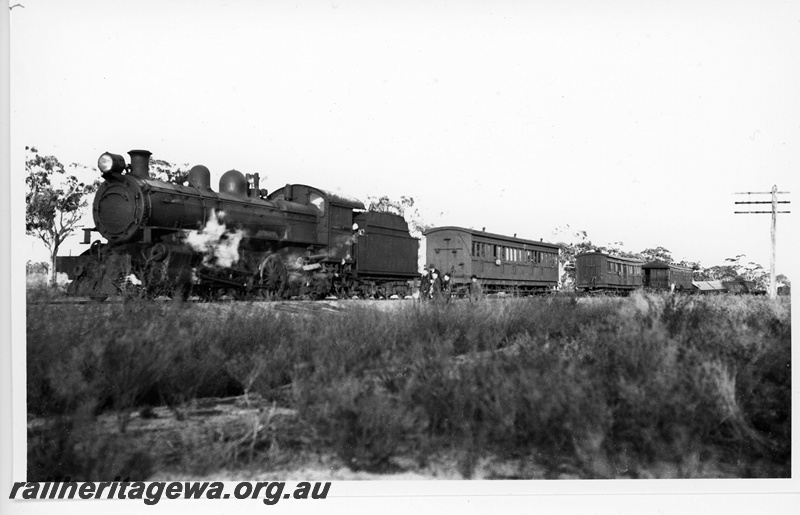 P20119
The derailment of No.8 Pass at Karping (10km south of Pingelly), GSR line,  on 22 August 1945 The loco and 6 carriages were derailed. Visible in the photo is loco, PR 459 DENMARK, ACL 191, ACL 202, AQS 288. The carriage in the distance partly on its side is AZ 439. The other cars not really visible are AQS 287 and ACL 231, view along the train., rural setting, telegraph pole, 
