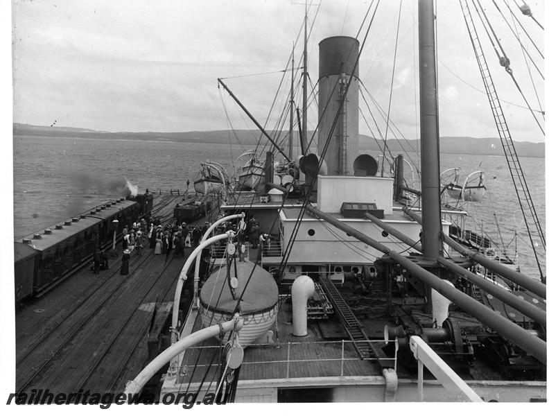 P20152
Steam loco on passenger train on wharf, crowd of passengers, steam ship, harbour, Albany deep-water wharf, view from upper deck of ship
