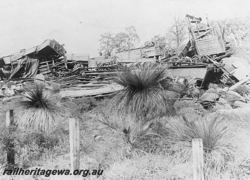 P20285
The wreckage of the runaway and derailment of No. 19 Mixed at Stoneville, ER line, on the 30/6/1896, the remains of carriage AB class 70 are visible, a number of wagons were also destroyed, one of the two men in the carriage died. A plaque marks the location on the heritage trail through the John Forrest National Park, 
