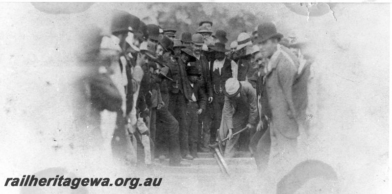 P20479
Driving of last spike of Great Southern Railway, onlookers, GSR line, track level view
