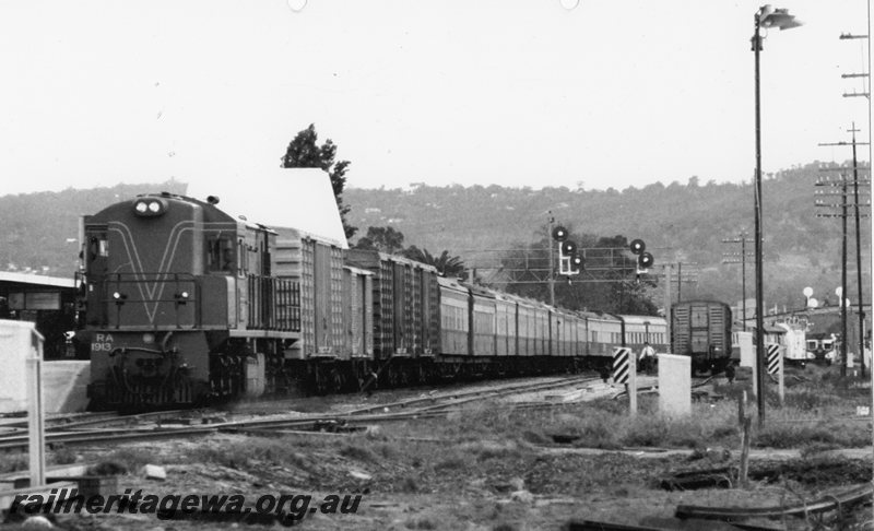 P20757
RA class 1913 up overnight passengers train arrives Midland Station. Several bogie vans behind locomotive. ER line.
