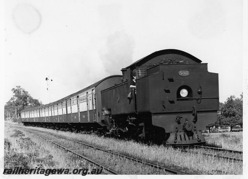 P20803
DD class 592, bunker first, on a suburban green and cream passenger set comprising two AYB class carriages and three AY class carriages, signal, Daglish, ER Line, side and front view of train

