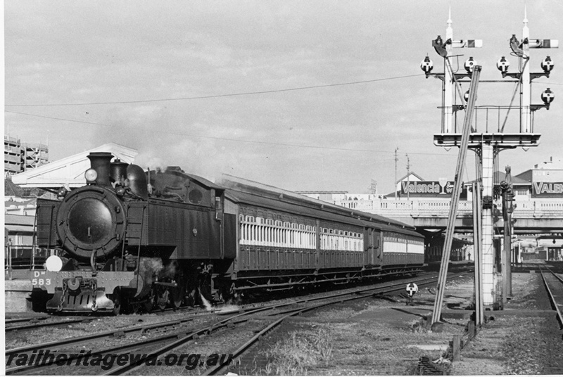 P20808
DM class 583, on a Royal Show special train comprising four AT class carriages and country brake van, about to depart Platform No. 5, canopy, overhead road bridge with Valencia Wine advertising, bracket signals,  Perth station, ER line, front and side view
