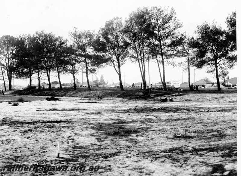 P20837
Site of proposed Railway Museum, trees, sand, houses in the background, survey post, Bassendean, ER line, overview
