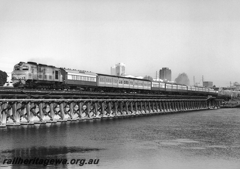 P20866
X class 1021 hauling a strengthened Down Australind  Express on the Bunbury Bridge, SWR line,  view f the whole train on the bridge
