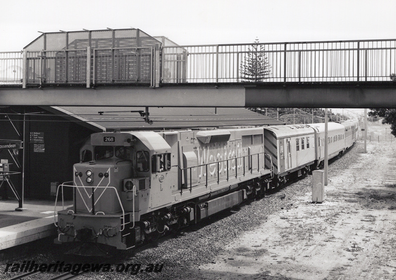 P20869
L class 268 in the Orange with blue stripe Westrail livery heading the Indian Pacific eastwards through Bassendean  front and side view along the train view
