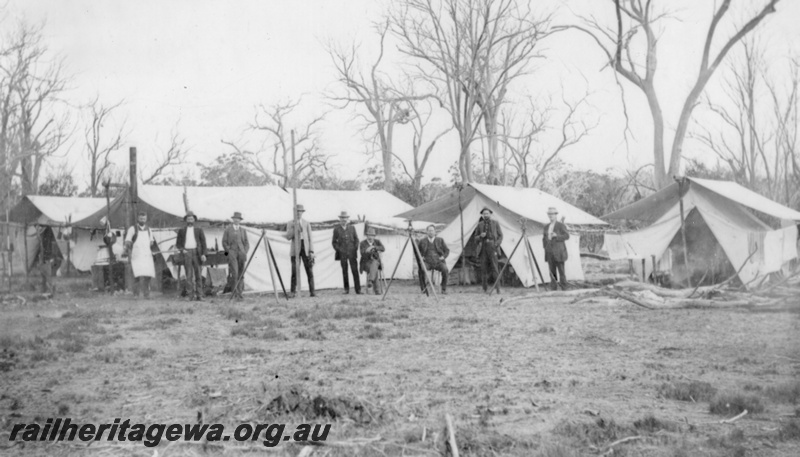 P20877
Group of tents with workers standing in front, Narrogin to Dwarda railway survey camp. PN line.
