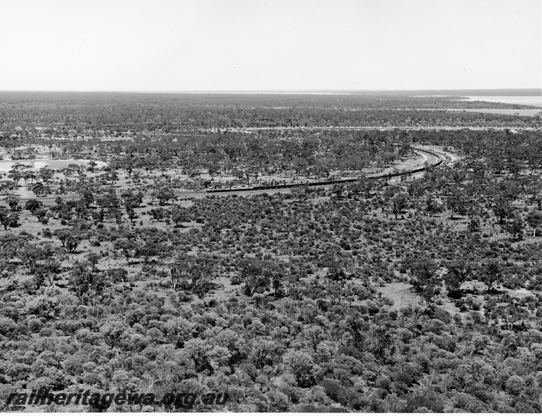 P20887
L class 255 leads another L class  approaches the  Koolyanobbing iron ore  mine. Distant view of train.  
