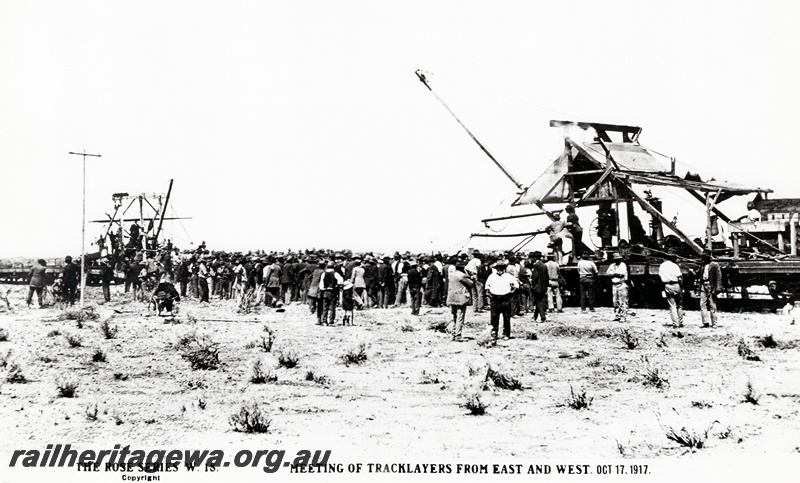 P20911
Meeting of tracklayers from east and west, tracklaying machinery, workers, Ooldea, TAR line, ground level view
