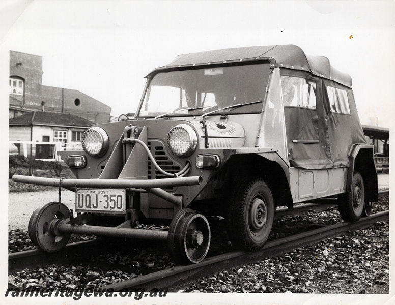 P20929
Rail/road Mini Moke, licence UQJ-350, on rails, front and side view
