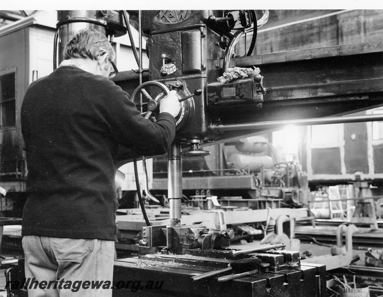 P20932
Worker operating Wade radial drill,  Block 1, Midland Workshops, view looking towards kitchen and car shop (later called 