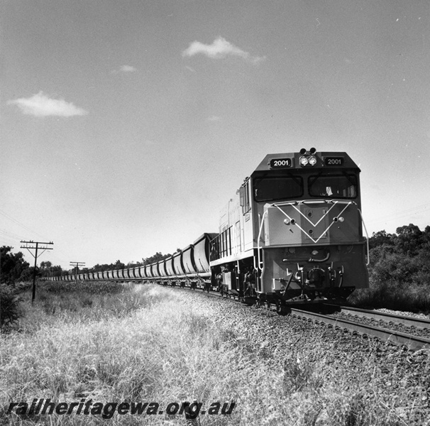 P20950
P class 2001, on goods train, Mundijong, SWR line, side and front view from trackside. First loaded revenue run by a P class.

