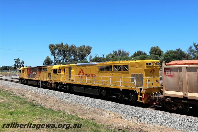 P21183
Aurizon Q class 4004 in the plain yellow livery with a red aurizon motif  trailing Q class 4011 in the yellow with grey and red panels livery heading a fright train southwards through Hazelmere
