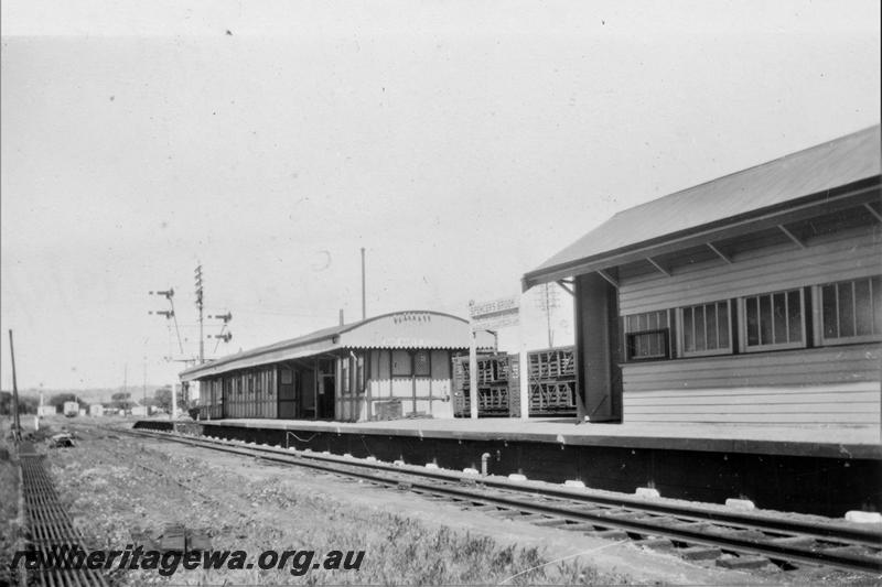 P21413
Station buildings, platform, tracks, bracket signals, rodding, station nameboard, livestock wagon, Spencer's Brook, ER line, view from trackside
