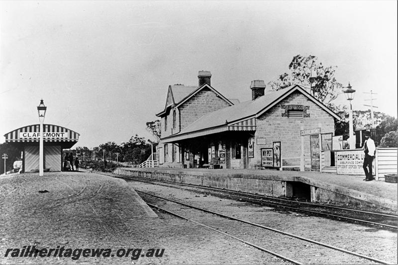 P21478
Station building, platforms, station nameboards, shelter shed, tracks, signal, passengers, Claremont, ER line, view from track level, c1895

